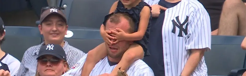 Fan makes unexpected, and adorable, no-look catch while getting ball for kid