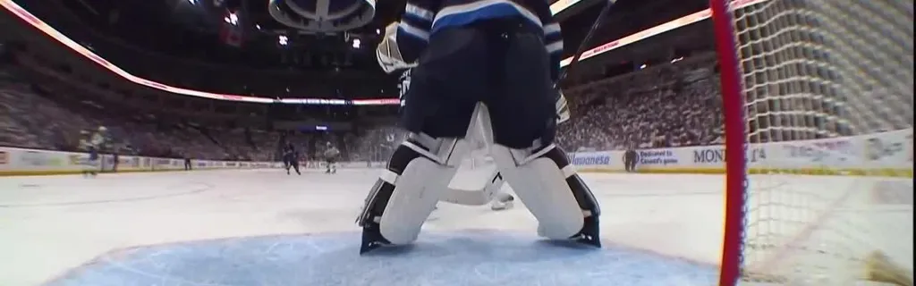 Hellebuyck keeps the puck out